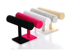 Macro detail of various velvet and linen T-bar jewelry display stands for watches