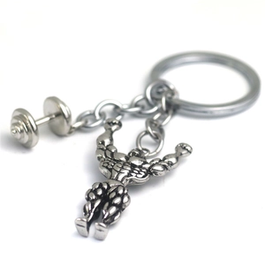 Strong muscular man keychain with dumbbell pendant made of polished silver metal