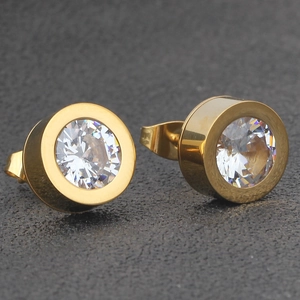 Macro detail of 11mm gold stainless steel stud earrings with brilliant white zircon