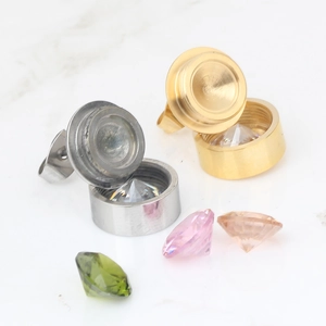 Close-up of detachable stainless steel stud earrings with interchangeable colorful zircon
