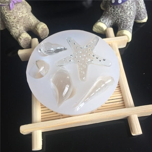 Macro detail of translucent silicone mold featuring starfish and seashell patterns
