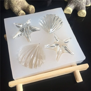 Starfish and seashell silicone resin mold with transparent ocean themed castings