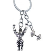 Detailed view of antique silver fitness keychain with muscular man and barbell charms