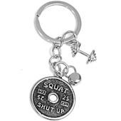 Close-up of barbell keychain detail with Squat and Shut Up engraving on the plates