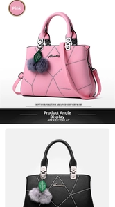 Detail of Aimily leather handbag with embroidery, metal logo, and plush charm accessory