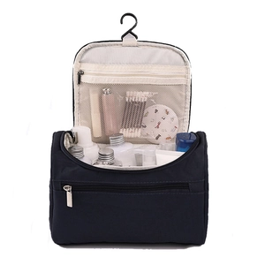 Large blue hanging camouflage toiletry bag with multiple compartments and mesh pockets