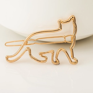 Minimalist gold alloy hair clip featuring a hollow cat silhouette on a white background