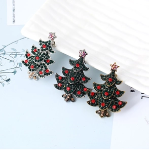 Detail of Christmas tree brooches with colorful rhinestones in silver gold and gunmetal