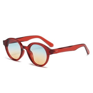 Vintage oval sunglasses with dark red transparent frame and blue-orange gradient lenses