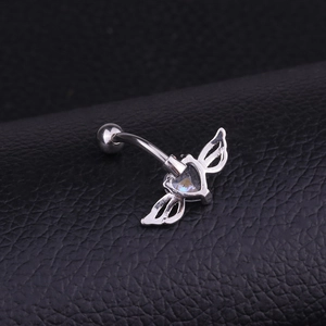 Silver stainless steel belly button ring featuring crystal heart and wing design details