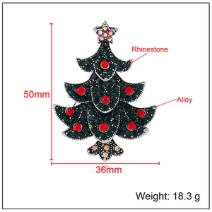 Vintage Christmas tree brooch with green rhinestones and red accents on alloy base