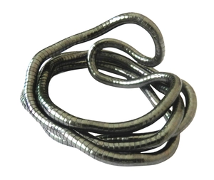 Macro shot of flexible silver snake chain with metallic coiled texture and bendable design