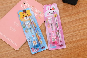 Close-up of bear and rabbit stationery sets with pencils, erasers and sharpeners