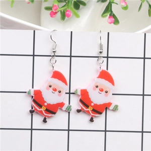 Detail view of funny Santa Claus acrylic drop earrings on a grid display card