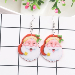 Detail of festive Santa Claus earrings with sunglasses on a white grid card backdrop