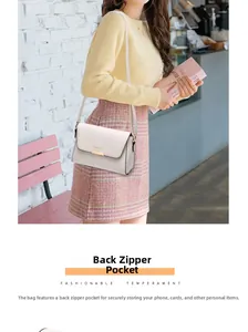Detail view of the anti-theft back zipper pocket on a stylish cream crossbody bag