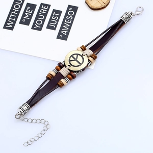 Multilayer leather bracelet with peace sign charm and wooden beads on white background