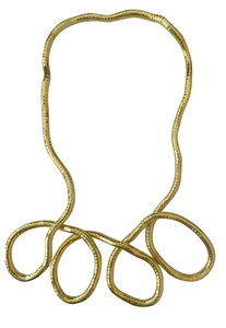 Macro view of flexible golden snake chain necklace with detailed metallic scale texture