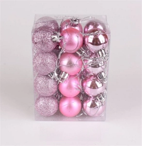 Pink Christmas ornaments in square box featuring matte, glossy, and glitter textures