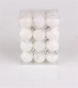 Detailed view of white Christmas tree balls in a transparent square gift box set