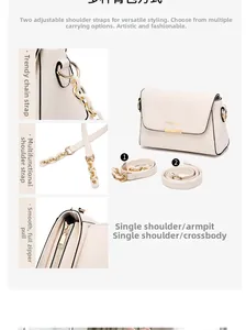 Detail of cream crossbody bag featuring golden chain strap and adjustable leather strap