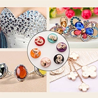 Detailed collage of assorted resin cherry, clover, and gemstone charms for DIY jewelry making