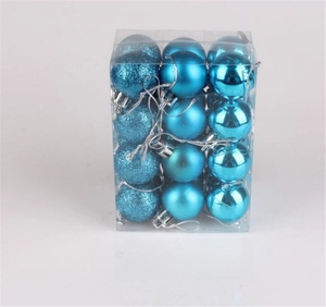 Detail of 24 lake blue Christmas balls in matte, glitter, and glossy finishes in a box