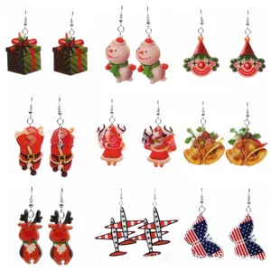 Detail of nine-pair acrylic Christmas earring set featuring Santa, snowmen, and reindeer
