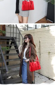 Detailed view of red lychee pattern handbag with gold hardware and detachable strap