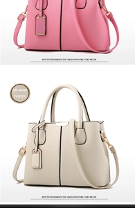 Close-up of pink and beige handbags with lychee texture and golden hardware details