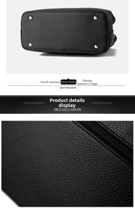 Macro detail of black lychee textured leather handbag with gold protective metal feet