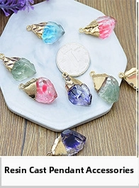 Detailed macro view of colorful resin irregular stone pendants with gold metal ring buckles