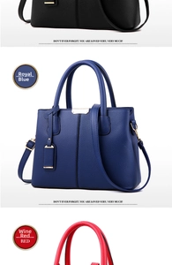 Detail view of lychee pattern leather handbags in black, blue, and red with gold hardware