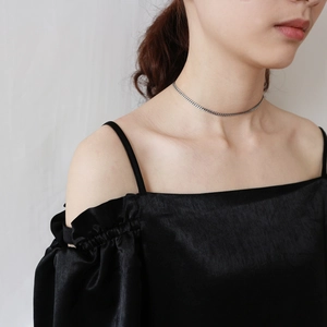 Minimalist 925 sterling silver choker chain necklace on a model wearing black dress
