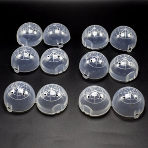 Macro detail of transparent plastic capsules with flexible hinges and air vents on top
