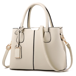 Elegant off-white lychee grain tote bag with gold hardware and detachable strap