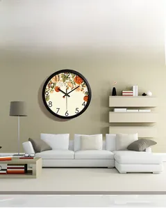 Modern silent stainless steel wall clock with vintage floral pattern in a cozy living room