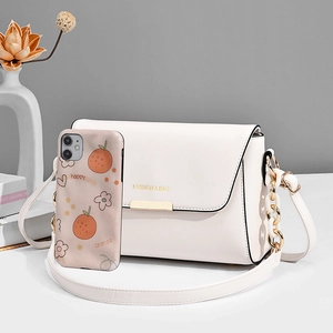 Minimalist white crossbody square bag with gold chain strap and fashion logo lettering