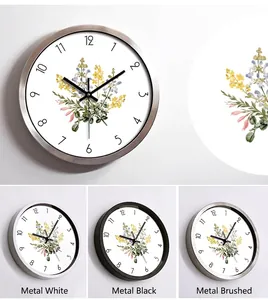 Minimalist metal wall clock with floral dial design in black, white, and brushed finishes