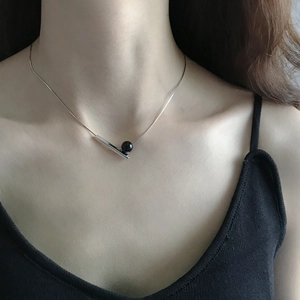 S925 sterling silver minimalist necklace featuring a black onyx bead and geometric bar pendant
