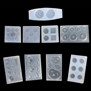 Detailed view of 9 different shapes of clear silicone molds for DIY mini clay cookies