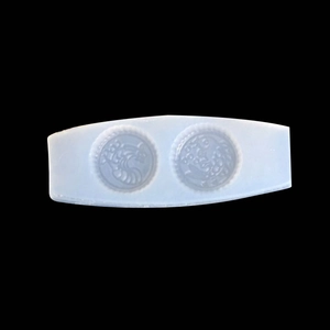 Detailed view of translucent silicone mold with intricate Oreo and croissant patterns