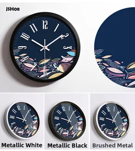Detail of round metal wall clock showing silent movement and colorful fish pattern art