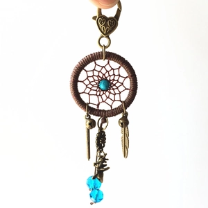 Detail of dreamcatcher keychain with turquoise beads, bronze feathers and heart lobster clasp
