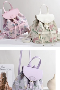 Detail of floral jacquard embroidery on colorful women backpacks with leather texture