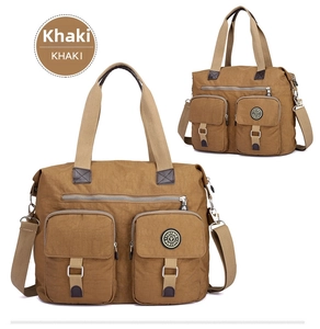 Detail of khaki water-resistant nylon handbag with double zippers and adjustable strap