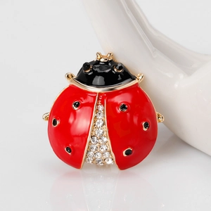 Red ladybug brooch in gold-plated alloy with sparkling crystals and enamel finish