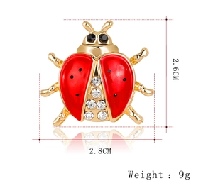 Detailed view of ladybug brooch with dimensions 2.6cm by 2.8cm and 9g weight info
