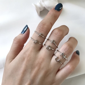 Minimalist 925 sterling silver letter ring with handmade wire wrap design on hand