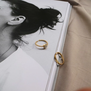 Elegant gold S925 sterling silver ring featuring a translucent cat eye stone detail